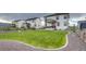 Spacious backyard with manicured lawn, fence, and gravel landscaping at 5392 Sanctuary Ave, Firestone, CO 80504