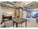 Unfinished basement offering ample space for recreation, including a foosball table and workout area at 5392 Sanctuary Ave, Firestone, CO 80504