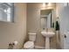 Elegant powder room features a pedestal sink, and wood look flooring at 5392 Sanctuary Ave, Firestone, CO 80504