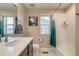 Well-lit bathroom showcasing a vanity, toilet, and shower-tub combo, with a clean and functional design at 5392 Sanctuary Ave, Firestone, CO 80504