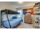 This bedroom features a bunk bed, wooden dresser, and themed decor, perfect for a room at 5392 Sanctuary Ave, Firestone, CO 80504