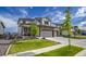Charming two-story home with stone accents, a three-car garage, and a well-manicured front lawn at 5392 Sanctuary Ave, Firestone, CO 80504