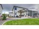 Back exterior of home with covered patio and landscaped yard at 5392 Sanctuary Ave, Firestone, CO 80504
