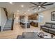 Inviting living space with staircase, modern kitchen, and comfortable seating area at 5392 Sanctuary Ave, Firestone, CO 80504