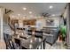 Open living space features modern kitchen, dining area and comfortable seating at 5392 Sanctuary Ave, Firestone, CO 80504