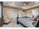 Airy main bedroom with a tray ceiling, an adjacent walk-in closet and a sitting area at 5392 Sanctuary Ave, Firestone, CO 80504