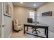 Cozy home office with desk, chair, and natural light at 5392 Sanctuary Ave, Firestone, CO 80504
