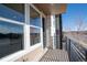 Balcony with metal railing, composite decking and exterior building facade at 15858 E Broncos Pl, Englewood, CO 80112