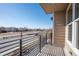 Private balcony featuring metal railings and pleasant neighborhood views at 15858 E Broncos Pl, Englewood, CO 80112