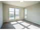 Bright bedroom with carpet, large windows offering lots of natural light and street view at 15858 E Broncos Pl, Englewood, CO 80112