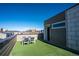 Enjoy this rooftop deck with turf and room to entertain, offering views of the neighborhood at 15858 E Broncos Pl, Englewood, CO 80112