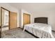 Comfortable bedroom with neutral carpet, a closet for storage, and convenient access to other areas of the home at 664 Stampede Dr, Brighton, CO 80603