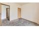 Bright bedroom with neutral carpet, a closet for storage, and easy access to other parts of the home at 664 Stampede Dr, Brighton, CO 80603