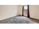 Bright bedroom with a window and neutral carpet, perfect for relaxation and rest at 664 Stampede Dr, Brighton, CO 80603