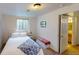 Comfortable bedroom with a double bed and adjoining bathroom at 2160 Ance St, Strasburg, CO 80136