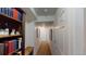 Hallway with bookshelf, carpet, and white doors at 2160 Ance St, Strasburg, CO 80136