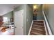 Inviting stairway leading to upper level, blending seamlessly with adjacent living spaces at 2160 Ance St, Strasburg, CO 80136