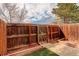 Backyard with wooden fence, artificial turf, and a garden plot at 9105 Oberon Rd # 2, Arvada, CO 80004