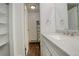 Updated bathroom features a modern vanity, fixtures, and shelving and includes a shower at 9105 Oberon Rd # 2, Arvada, CO 80004