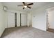 Bright bedroom with a ceiling fan, updated mini-split system, and double closets at 9105 Oberon Rd # 2, Arvada, CO 80004