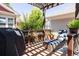 Back deck featuring a lounge chair, grill, and patio furniture under a pergola at 10069 E 28Th Ave, Denver, CO 80238