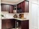 Wet bar with wine storage, granite countertops, and sink at 10069 E 28Th Ave, Denver, CO 80238
