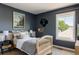 Comfortable bedroom with natural light from window and stylish decor at 10069 E 28Th Ave, Denver, CO 80238