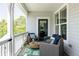 Inviting front porch with cozy seating, ideal for relaxing and enjoying the outdoors in comfort and style at 10069 E 28Th Ave, Denver, CO 80238