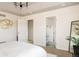 Bright main bedroom featuring multiple closets and an ensuite bathroom at 10069 E 28Th Ave, Denver, CO 80238
