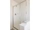 Bright shower with glass enclosure, white tiling, and modern fixtures at 10069 E 28Th Ave, Denver, CO 80238
