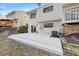 View of the home's back exterior with a deck overlooking the yard at 19697 E Flora Pl, Aurora, CO 80013