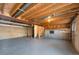 Unfinished basement with exposed beams and ductwork, offering potential for customization at 19697 E Flora Pl, Aurora, CO 80013
