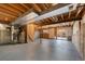 Unfinished basement with exposed beams and ductwork, offering potential for customization at 19697 E Flora Pl, Aurora, CO 80013