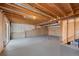 Unfinished basement with exposed beams and ductwork, offering potential for customization at 19697 E Flora Pl, Aurora, CO 80013