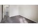 Simple carpeted bedroom with closet doors, and access to another room at 19697 E Flora Pl, Aurora, CO 80013
