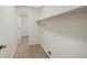 Bright laundry room featuring plenty of space and a door to an adjacent bathroom at 19697 E Flora Pl, Aurora, CO 80013