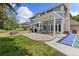 Outdoor patio boasts a covered dining area, a basketball court, and beautifully landscaped surroundings, perfect for gatherings at 2555 S Zang St, Denver, CO 80228