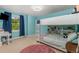 Stylish bedroom featuring a bunkbed, a small desk, and a window with natural light at 2555 S Zang St, Denver, CO 80228
