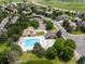 A community pool with tennis courts and a playground surrounded by mature trees at 2555 S Zang St, Denver, CO 80228