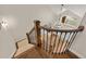 Elegant foyer featuring hardwood staircase, iron railings, and chandelier lighting, showcasing the entry at 2555 S Zang St, Denver, CO 80228