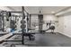 Home gym featuring a full set of weights, a rowing machine, and a weight rack at 2555 S Zang St, Denver, CO 80228