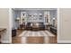 Cozy living room featuring hardwood floors, neutral paint, and dark leather furniture at 2555 S Zang St, Denver, CO 80228