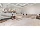 Spacious living room with plush carpet, a large sectional, and built-in shelving, open to the rest of the home at 2555 S Zang St, Denver, CO 80228