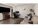 Cozy living room with modern entertainment center and comfortable seating area, great for relaxing or entertaining at 2555 S Zang St, Denver, CO 80228
