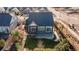 Aerial view of a home with a fenced backyard, patio, and landscaped garden at 21701 E 50Th Dr, Aurora, CO 80019
