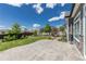 Spacious backyard with a stamped concrete patio and mature trees at 21701 E 50Th Dr, Aurora, CO 80019