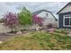 Well maintained backyard with green lawn and landscaping at 21701 E 50Th Dr, Aurora, CO 80019
