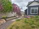 Well-maintained backyard features a lush lawn and tidy landscaping at 21701 E 50Th Dr, Aurora, CO 80019