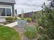 Lush backyard featuring a unique water trough planter and meticulous landscaping at 21701 E 50Th Dr, Aurora, CO 80019