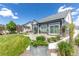 Landscaped backyard with patio, grass, and a well-maintained exterior at 21701 E 50Th Dr, Aurora, CO 80019